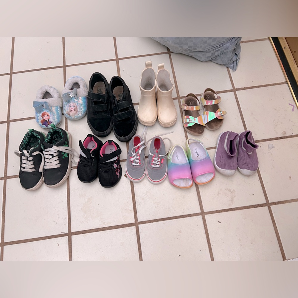 Some children’s vans, rain boots, target brand summer shoes, and some slippers